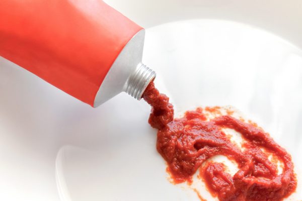 Tube packaging tomato paste squeezing out