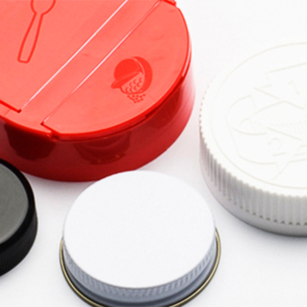 MJS Packaging lids and designs on desk.